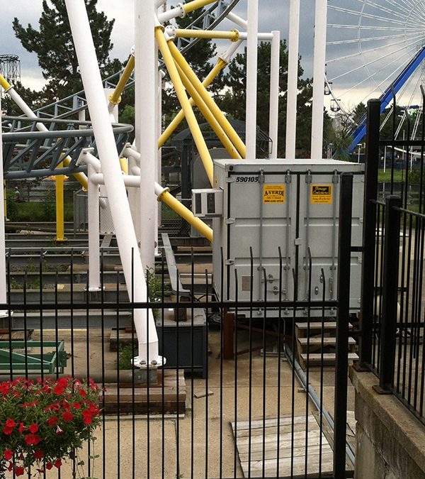 A-Verdi Storage Container placed inside an amusement park near a roller coaster for secure on-site storage.