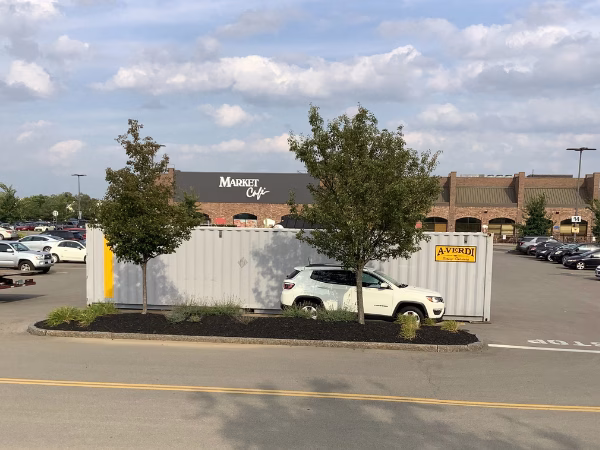 A-Verdi portable storage container rental in a retail parking lot in New York &mdash; ideal for business renovations, seasonal inventory, and commercial storage needs.