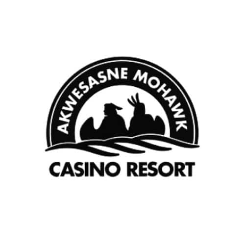 Black and white logo for Akwesasne Mohawk Casino Resort, featuring two silhouetted Mohawk figures—one wearing a traditional feathered headdress—set inside a semi-circle with stylized wave lines beneath.