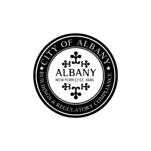 Black and white circular seal for the City of Albany Buildings & Regulatory Compliance department. The design features stylized decorative elements in the center with the text “Albany, New York | Est. 1686” and surrounding text reading “City of Albany” and “Buildings & Regulatory Compliance” separated by stars.