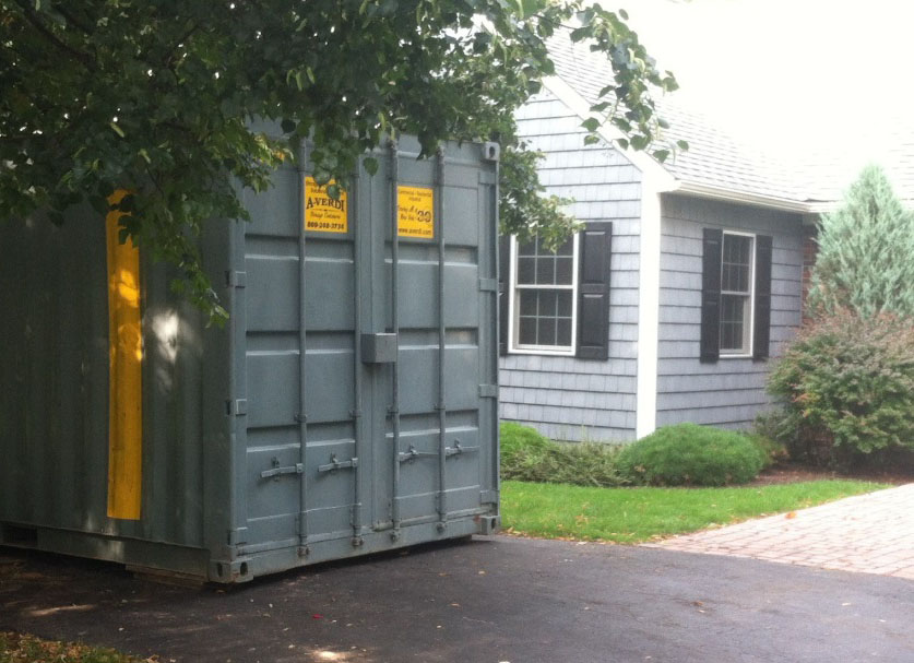 A-Verdi portable storage container placed on a residential driveway for convenient home renovation or moving storage.