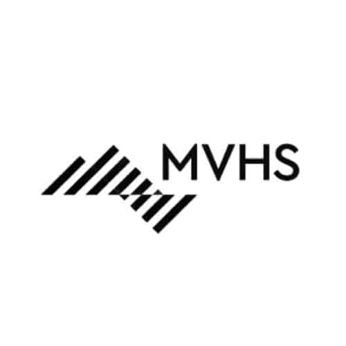 Stylized black and white triangular emblem to the left of the bold letters “MVHS” in uppercase, modern sans-serif font.